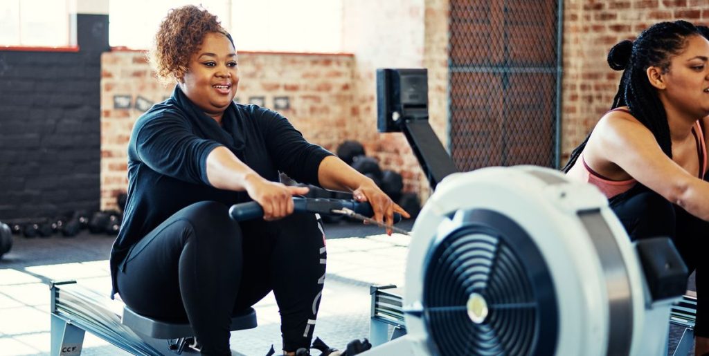 The Best Rowing Machine Workouts For All Levels, According To Trainers