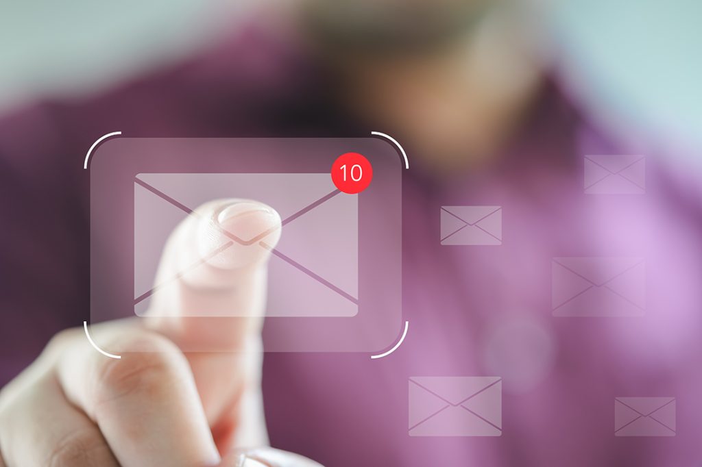 3 Tips for Efficient Email Clean Up man touching email icon