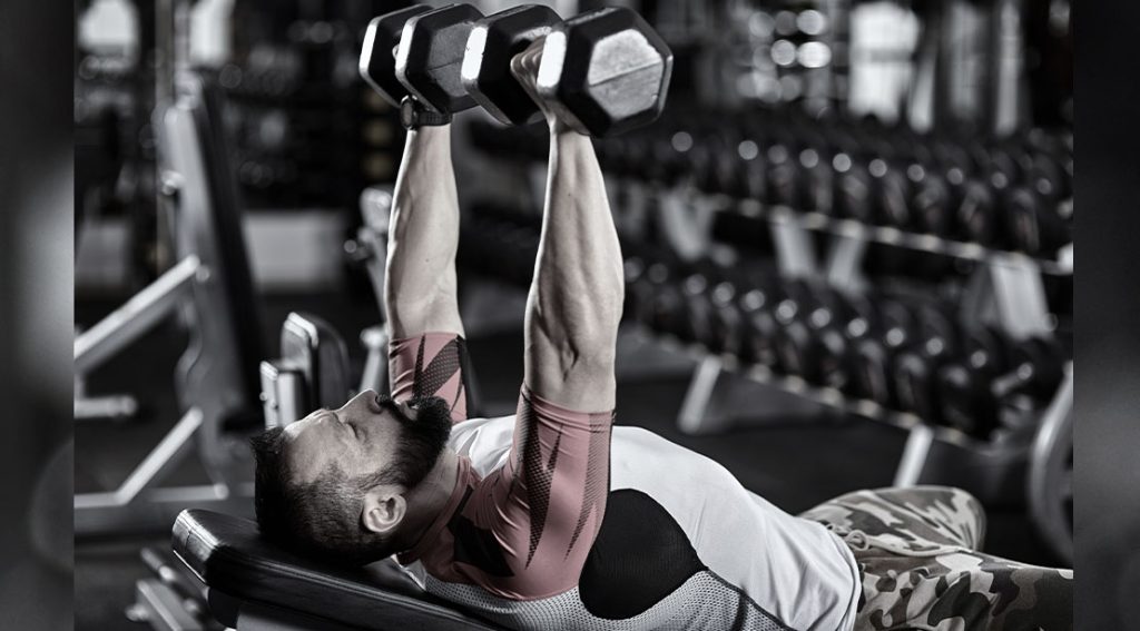 The Dumbbell EMOM Workout To Build Full-Body Strength in Just 15 Minutes